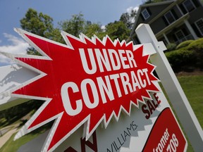 FILE - In this Tuesday, May 16, 2017, file photo, a sign advertises that an existing home for sale is under contract in Roswell, Ga. On Thursday, Nov. 2, 2017, Freddie Mac reports on the week's average U.S. mortgage rates. (AP Photo/John Bazemore, File)