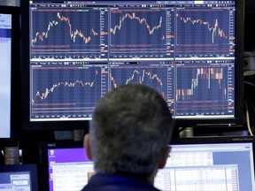 FILE - In this Wednesday, May 3, 2017, file photo, specialist Anthony Rinaldi works on the floor of the New York Stock Exchange. For all the worries about when the stock market will finally crack, one of the biggest reasons for its rise keeps chugging along. Corporate profits continue to pile higher, and companies have been lining up in recent weeks to tell investors that they made more during the summer than Wall Street had forecast. (AP Photo/Richard Drew, File)