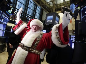 FILE - In this Wednesday, Nov. 25, 2015, file photo, Santa Claus visits the trading floor of the New York Stock Exchange before the opening bell. Stocks have already exceeded most expectations in 2017, and it looks like Santa Claus will drop by to give investors another gift before the year comes to a close. (AP Photo/Richard Drew, File)