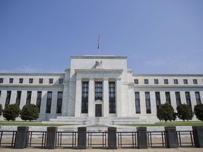 This Wednesday, Aug. 2, 2017, photo shows the Federal Reserve Building on Constitution Avenue in Washington. The Federal Reserve has begun the slow process of paring back its $4.5 trillion bond portfolio, and the stock market's reaction has been barely a yawn. A lot is riding on whether markets can continue to remain calm. (AP Photo/Pablo Martinez Monsivais)