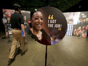 FILE - In this Friday, May 19, 2017, file photo, job seekers walk into the Opportunity Fair and Forum employment event in Dallas. On Friday, Nov. 17, 2017, the Labor Department reports on state unemployment rates for October. (AP Photo/LM Otero, File)