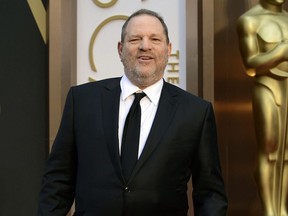 FILE - In this March 2, 2014 file photo, Harvey Weinstein arrives at the Oscars at the Dolby Theatre in Los Angeles. Weinstein has been accused by dozens of women of sexual harassment or assault. He was fired by The Weinstein Co. and expelled from various professional guilds. His is currently under investigation by police departments in New York, London, Beverly Hills and Los Angeles and denies all allegations of non-consensual sex.   (Photo by Jordan Strauss/Invision/AP, File)