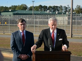South Carolina Corrections Director Bryan Stirling, left, and Gov. Henry McMaster stand outside the state's death row at Broad River Correctional Institution in Columbia, S.C. Stirling and McMaster announced Monday the state doesn't have the drugs it needs for lethal injection and can't carry out an execution scheduled for December 1. (AP Photo/Meg Kinnard)