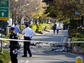 Bicycles and debris lay on a bike path after a motorist drove onto the path near the World Trade Center memorial, striking and killing several people Tuesday, Oct. 31, 2017.  (AP Photo/Craig Ruttle)