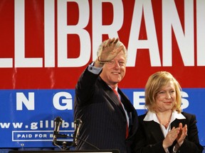 FILE- In this Oct. 26, 2006 file photo, Former President Bill Clinton and Kirsten Gillibrand, a Democratic lawyer who is running against three-term Rep. John Sweeney, R-N.Y., acknowledge the crowd at a rally in Albany, N.Y. U.S. Sen. Kirsten Gillibrand said, in an interview in The New York Times, that former President Clinton should have resigned over his sexual affair with White House intern Monica Lewinsky 20 years ago.  (AP Photo/Jim McKnight, File)