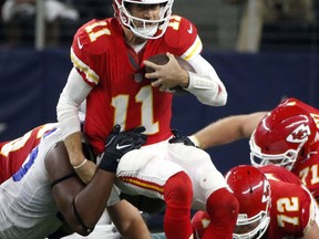 FILE - In this Sunday, Nov. 5, 2017, file photo, Dallas Cowboys defensive tackle David Irving, left, sacks Kansas City Chiefs quarterback Alex Smith (11) in the second half of an NFL football game in Arlington, Texas. The Chiefs hope a week off can serve as a reset to their season. They began 5-0 before losing three of their last four, and quarterback Alex Smith even threw an interception in a loss to Dallas just before the bye. (AP Photo/Michael Ainsworth, File)