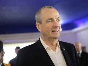FILE - In this Nov. 6, 2017 file photo, Democratic gubernatorial candidate Phil Murphy arrives to a campaign event in Edison, N.J.  Murphy defeated Republican Lt. Gov. Kim Guadagno to succeed Republican Gov. Chris Christie.  (AP Photo/Seth Wenig)