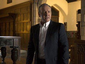 This image released by Netflix shows Kevin Spacey in a scene from "House Of Cards." Netflix says it's suspending production on "House of Cards" following harassment allegations against Spacey.  (David Giesbrecht/Netflix via AP)
