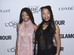 FILE - In this Nov. 13, 2017 file photo, Halle Bailey, left, and Chloe Bailey of Chloe x Halle attend the 2017 Glamour Women of the Year Awards in New York. The group will perform a new track written for the UNICEF initiative World Children's Day on Nov. 20. (Photo by Evan Agostini/Invision/AP)