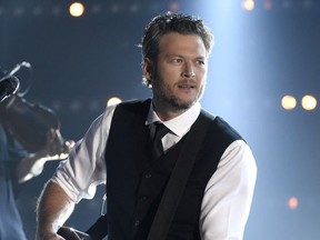 FILE - In this Nov. 4, 2015 file photo, Blake Shelton performs at the 49th annual CMA Awards in Nashville, Tenn. Shelton was named as People magazine's 2017 "Sexiest Man Alive." (Photo by Chris Pizzello/Invision/AP, File)