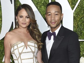 FILE - In this June 11, 2017 file photo, Chrissy Teigen, left and John Legend arrive at the 71st annual Tony Awards in New York. Teigen and Legend are expanding their family. The model and the musician used social media Tuesday, Nov. 21, to announce that they're expecting their second child.(Photo by Evan Agostini/Invision/AP, File)