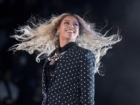 FILE - In this Nov. 4, 2016 file photo, Beyonce performs at a Get Out the Vote concert for Democratic presidential candidate Hillary Clinton in Cleveland. Beyonce Knowles-Carter is joining the cast of "The Lion King" to voice to role of Nala. The Walt Disney Studios revealed the main cast for its upcoming live-action and CG adaptation of its 1994 animated classic Wednesday and confirmed the months old rumor that the pop superstar would be lending her voice to the project. (AP Photo/Andrew Harnik, File)