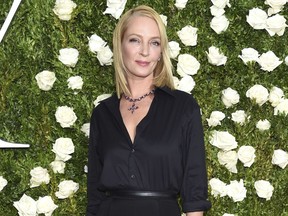 FILE - In this June 11, 2017 file photo, Uma Thurman arrives at the 71st annual Tony Awards in New York. Thurman wished everyone a happy Thanksgiving except disgraced movie mogul Harvey Weinstein, saying in a cryptic online post that he doesn't "deserve a bullet."  Thurman starred in the Weinstein-produced films "Pulp Fiction" and the "Kill Bill" films. (Photo by Evan Agostini/Invision/AP, File)