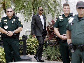 FILE - In this Oct. 27, 2017, file photo, Golfer Tiger Woods arrives at the Palm Beach County courthouse in Palm Beach Gardens, Fla. Woods returns this week to the Hero World Challenge in the Bahamas. It's the 10th time he has returned after a layoff of 10 week or longer. (AP Photo/Alan Diaz, File)