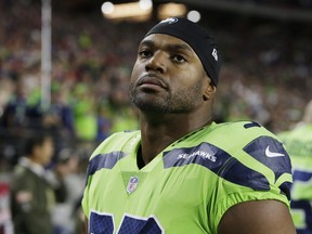FILE - In this Nov. 9, 2017, file photo, Seattle Seahawks defensive end Dwight Freeney (93) watches play during an NFL football game against the Arizona Cardinals in Glendale, Ariz. The Detroit Lions have added Freeney off waivers from Seattle. Detroit acquired the 37-year-old Freeney Wednesday, Nov. 22, a day before hosting the Minnesota Vikings in a possibly pivotal game for the NFC North title. (AP Photo/Rick Scuteri, File)