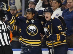 Buffalo Sabres' Evander Kane (9) and Jack Eichel (15) celebrate a teammate's goal during the first period of an NHL hockey game against the Minnesota Wild, Wednesday Nov. 22, 2017, in Buffalo, N.Y. (AP Photo/Jeffrey T. Barnes)