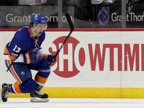 New York Islanders center Mathew Barzal (13) reacts after scoring a goal against the Carolina Hurricanes during the first period of an NHL hockey game, Thursday, Nov. 16, 2017, in New York. (AP Photo/Julie Jacobson)