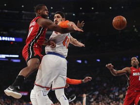 Miami Heat guard Dion Waiters (11) passes the ball against New York Knicks center Enes Kanter (00) during the first quarter of an NBA basketball game, Wednesday, Nov. 29, 2017, in New York. (AP Photo/Julie Jacobson)