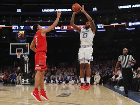 Seton Hall guard Myles Powell (13) shoots against Texas Tech guard Zhaire Smith (2) during the first half of an NCAA college basketball game, Thursday, Nov. 30, 2017, in New York. (AP Photo/Julie Jacobson)
