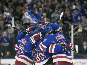 The New York Rangers celebrate after right wing Pavel Buchnevich scored during the second period of the NHL game between the Edmonton Oilers, Saturday, Nov. 11, 2017 in New York. (AP Photo/Kevin Hagen)