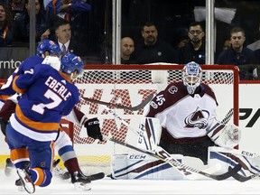 New York Islanders center Jordan Eberle (7) takes a shot against Colorado Avalanche goalie Jonathan Bernier (45) for the Islanders' second goal during the first period of an NHL hockey game in New York, Sunday, Nov. 5, 2017. (AP Photo/Kathy Willens)