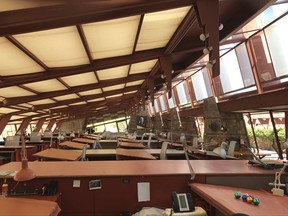 This Sept. 24, 2017, photo shows the drafting room at Taliesin West in Scottsdale, Ariz., the winter home of architect Frank Lloyd Wright and the architecture school he founded. Many of Wright's famous buildings were designed in this room, including the Guggenheim Museum in New York. Wright's students also mapped out their own creations on the sloping desks that look out at the desert through broad windows. (AP Photo/Anita Snow)
