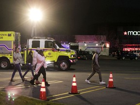 People are evacuated after reports of shots fired at the Galleria at Crystal Run, Sunday, Nov. 26, 2017, in Middletown, N.Y. (Allyse Pulliam/Times Herald-Record via AP)