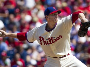 FILE - In this Aug. 24, 2013, file photo, Philadelphia Phillies starting pitcher Roy Halladay throws a pitch during the first inning of a baseball game against the Arizona Diamondbacks, in Philadelphia. Authorities have confirmed that former Major League Baseball pitcher Roy Halladay died in a small plane crash in the Gulf of Mexico off the coast of Florida, Tuesday, Nov. 7, 2017.  (AP Photo/Christopher Szagola, File)