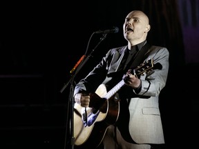 FILE - In this Saturday, March 26, 2017 file photo, Billy Corgan of the Smashing Pumpkins performs at The Theatre at Ace Hotel in Los Angeles. Billy Corgan is more than just another celebrity immersed in wrestling as some sort of quirky promotional stunt. The Smashing Pumpkins lead singer has been involved in wrestling for more than a decade. But his next step is his biggest gamble yet. Corgan now owns the NWA - the old 1970s and 80s home of Ric Flair and Harley Race, among other greats, and hopes to return the forgotten promotion to relevance, Saturday, Nov. 11, 2017. (Photo by Chris Pizzello/Invision/AP, File)
