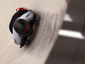 Janine Flock of Austria rounds a curve during the women's World Cup skeleton event in Lake Placid, N.Y., on Thursday, Nov. 9, 2017. Flock placed first in the event. (AP Photo/Peter Morgan)