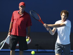 FILE - In this Jan. 26, 2012 file photo, Britain's Andy Murray, right, is watched by his coach Ivan Lendl as he trains in Rod Laver Arena at the Australian Open tennis championship, in Melbourne, Australia. Murray and Lendl are calling it quits for a second time, ending a partnership that produced three Grand Slam titles and two Olympic gold medals. (AP Photo/Rick Rycroft, File)