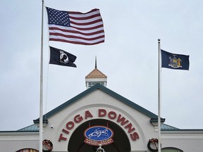 FILE--This photo from Dec. 2, 2016 shows the entrance of Tioga Downs Casino in Nichols, N.Y. Revenues from three new upstate New York casinos have come in far slower than projected, meaning less money shared with local towns, cities and counties. (AP Photo/Heather Ainsworth, File)