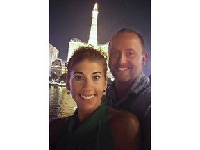 This undated photo provided by Jamie Billquist, right, shows him with his wife Rosemary Billquist in Las Vegas, NV. "It was on our 20th wedding anniversary," said Jamie Billquist. "I surprised her with a trip to Vegas and we stayed at the Bellagio--we had a blast." Rosemary Billquist, a 43-year-old hospital worker, hospice volunteer and marathoner, was killed Thanksgiving eve while walking her dogs in a field behind her home. (Jamie Billquist via AP)