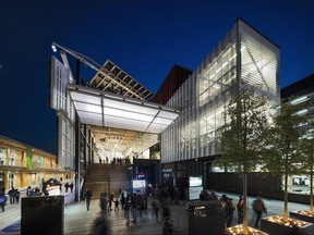 In this 2015 photo provided by Biber Architects, visitors walk through the U.S. pavilion at the Milano Expo in Milan. The exhibition was built to showcase America to the world, and over 6 million visitors made it a popular pavilion at the 2015 World Expo in Italy but the government-delegated nonprofit group that ran it has gone bankrupt, and attempts at a federal bailout have stopped, leaving $28 million in debts from Manhattan to Milan. (Paul Warchol/Biber Architects via AP)