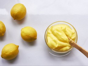 This October 2017 photo provided by Laura Agra shows lemon curd on display in New York. Lemon curd is essentially a preserve or condiment made with lemon juice, eggs, sugar and butter. The first three ingredients get blended and softly warmed so that the eggs thicken the mixture. Whisking in cold butter finishes it off and smoothes it out. (Courtesy of Laura Agra via AP)