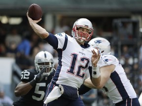 FILE - In this Sunday, Nov. 19, 2017, file photo, New England Patriots quarterback Tom Brady (12) passes against the Oakland Raiders during the first half of an NFL football game in Mexico City. The Patriots have won six straight and are again the team to beat in the AFC East. They will play five of their final six games against division opponents. First up is the Miami Dolphins, on Sunday, Nov. 26, who have lost four straight and may have to give Matt Moore his second start this season at quarterback with Jay Cutler in the concussion protocol. (AP Photo/Rebecca Blackwell, File)