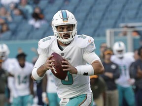 FILE - In this Sunday, Nov. 19, 2017, file photo, Miami Dolphins quarterback Matt Moore (8) looks to pass the ball during the second half of an NFL football game against the Tampa Bay Buccaneers, in Miami Gardens, Fla. The New England Patriots have won six straight and are again the team to beat in the AFC East. They will play five of their final six games against division opponents. First up is the Dolphins, on Sunday, Nov. 26, who have lost four straight and may have to give Moore his second start this season at quarterback with Jay Cutler in the concussion protocol. (AP Photo/Lynne Sladky, File)