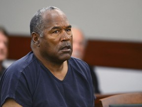 FILE - In this May 14, 2013, file photo, O.J. Simpson appears at an evidentiary hearing in Clark County District Court in Las Vegas.  Simpson's attorney says the former football star has been banned from The Cosmopolitan hotel-casino in Las Vegas. Attorney Malcolm LaVergne on Thursday, Nov. 9, 2017, told The Associated Press that Simpson received a trespass notice from the hotel Wednesday. (Ethan Miller via AP, Pool, File)