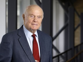 FILE - In this Jan. 25, 2012, file photo, former astronaut and Sen. John Glenn poses for a photo during an interview at his office in Columbus, Ohio. The Ohio birthplace of the late astronaut is celebrating its place in history with a historic marker commemorating the astronaut and U.S. senator who died last year. Officials in Cambridge will hold a ceremony Thursday, Nov. 9, 2017, to unveil the marker. Glenn was born there on July 18, 1921. The commemoration was spearheaded by the local convention and visitors' bureau. It's part of increased efforts to honor Glenn's legacy since his death on Dec. 8, 2016. (AP Photo/Jay LaPrete, File)