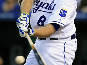 FILE- This Aug. 19, 2017, file shows Kansas City Royals' Mike Moustakas hitting a double off Cleveland Indians starting pitcher Trevor Bauer during the sixth inning of a baseball game at Kauffman Stadium in Kansas City, Mo. Kansas City Royals first baseman Eric Hosmer, third baseman Moustakas and outfielder Lorenzo Cain were among nine free agents who turned down $17.4 million qualifying offers from their teams Thursday, Nov. 16, 2017. (AP Photo/Orlin Wagner, File)