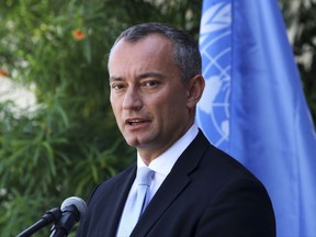 FILE - In a Monday, Sept. 25, 2017 file photo, United Nations Special Coordinator for the Middle East Peace Process Nickolay Mladenov, attends a press conference at the (UNSCO) offices in Gaza City. Mladenov said Monday, Nov. 20, 2017,  that reconciliation talks between Palestinian rivals Fatah and Hamas must succeed, warning that failure "will most likely result in another devastating conflict."(AP Photo/Adel Hana, File)