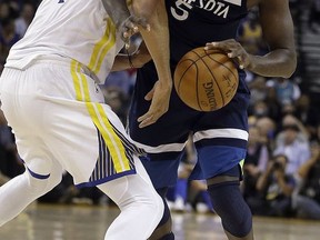Minnesota Timberwolves' Gorgui Dieng, right, is fouled by Golden State Warriors' JaVale McGee during the first half of an NBA basketball game Wednesday, Nov. 8, 2017, in Oakland, Calif. (AP Photo/Ben Margot)