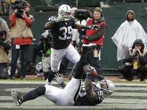 Oakland Raiders linebacker NaVorro Bowman (53) intercepts a pass in the end zone during the first half of an NFL football game against the Denver Broncos in Oakland, Calif., Sunday, Nov. 26, 2017. (AP Photo/Ben Margot)