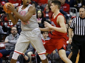 Ohio State's Kaleb Wesson, left, posts up against Northeastern's Tomas Murphy during the first half of an NCAA college basketball game Sunday, Nov. 19, 2017, in Columbus, Ohio. (AP Photo/Jay LaPrete)