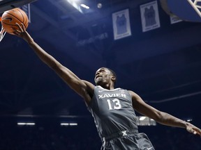 Xavier's Naji Marshall shoots in the first half of an NCAA college basketball game against Hampton, Monday, Nov. 20, 2017, in Cincinnati. (AP Photo/John Minchillo)