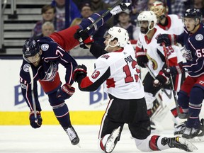 Columbus Blue Jackets forward Nick Foligno, left, collides with Ottawa Senators forward Nick Paul during the first period of an NHL hockey game in Columbus, Ohio, Friday, Nov. 24, 2017. (AP Photo/Paul Vernon)