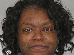 This undated photo provided by the Hamilton County Sheriff's Office in Cincinnati shows Yakyma Boyd, a veteran employee in the Hamilton County Clerk of Courts office in Cincinnati arrested Wednesday, Nov. 8, 2017, on two felony counts of tampering with records. Authorities say Boyd has been suspended without pay, accused of leaking confidential information from search warrants to a drug suspect who authorities say then warned potential law enforcement targets. (Hamilton County Sheriff's Office via AP)