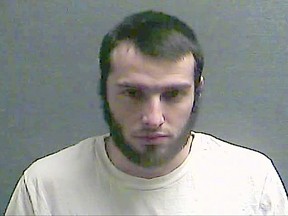 FILE – This July 29, 2016, file photo, provided by the Boone County Jail in Burlington, Ky., shows Christopher Lee Cornell, of Green Township in suburban Cincinnati. Cornell, serving 30 years in prison for plotting to attack the U.S. Capitol in support of the Islamic State group, wants his plea and sentence thrown out, arguing that he was mentally incompetent and was entrapped by the FBI. (Boone County Jail via AP, File)
