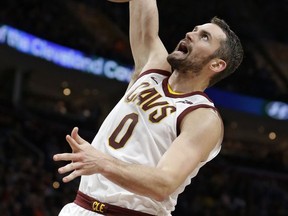 Cleveland Cavaliers' Kevin Love dunks the ball against the Miami Heat in the first half of an NBA basketball game, Tuesday, Nov. 28, 2017, in Cleveland. (AP Photo/Tony Dejak)