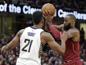 Cleveland Cavaliers' LeBron James, right, drives against Indiana Pacers' Thaddeus Young in the first half of an NBA basketball game, Wednesday, Nov. 1, 2017, in Cleveland. (AP Photo/Tony Dejak)
